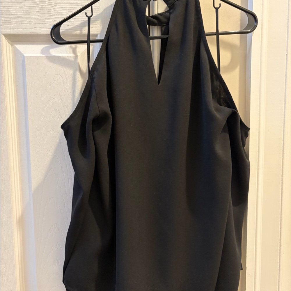 Elegant, sexy black cold shoulder top. Lined.